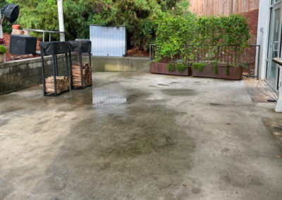 Stained patio prior to pressure wash.