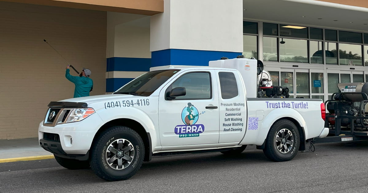 A Terra Pro-Wash pressure washing truck outside of a retail store