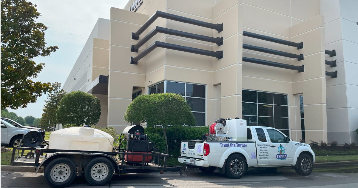 A Terra Commercial Property Services truck outside of an industrial building