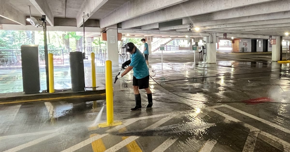 Terra Pro-Wash employees cleaning a parking deck