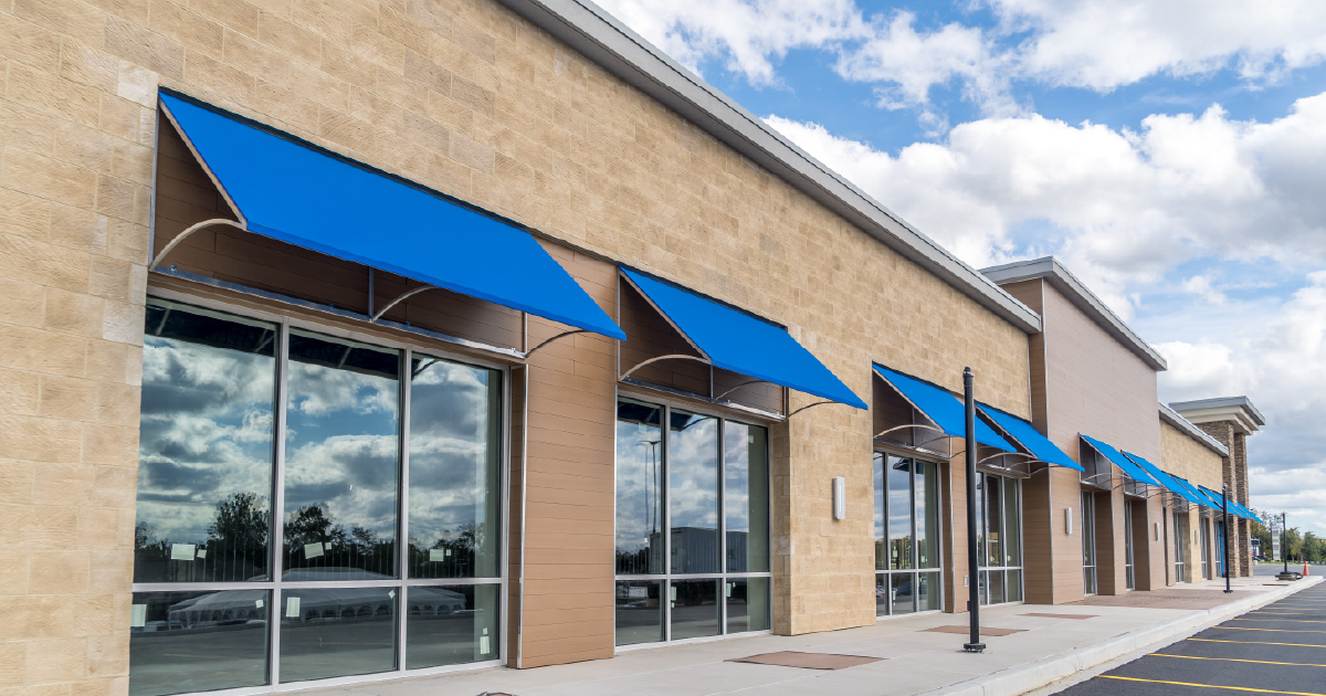 A commercial building with clean awnings