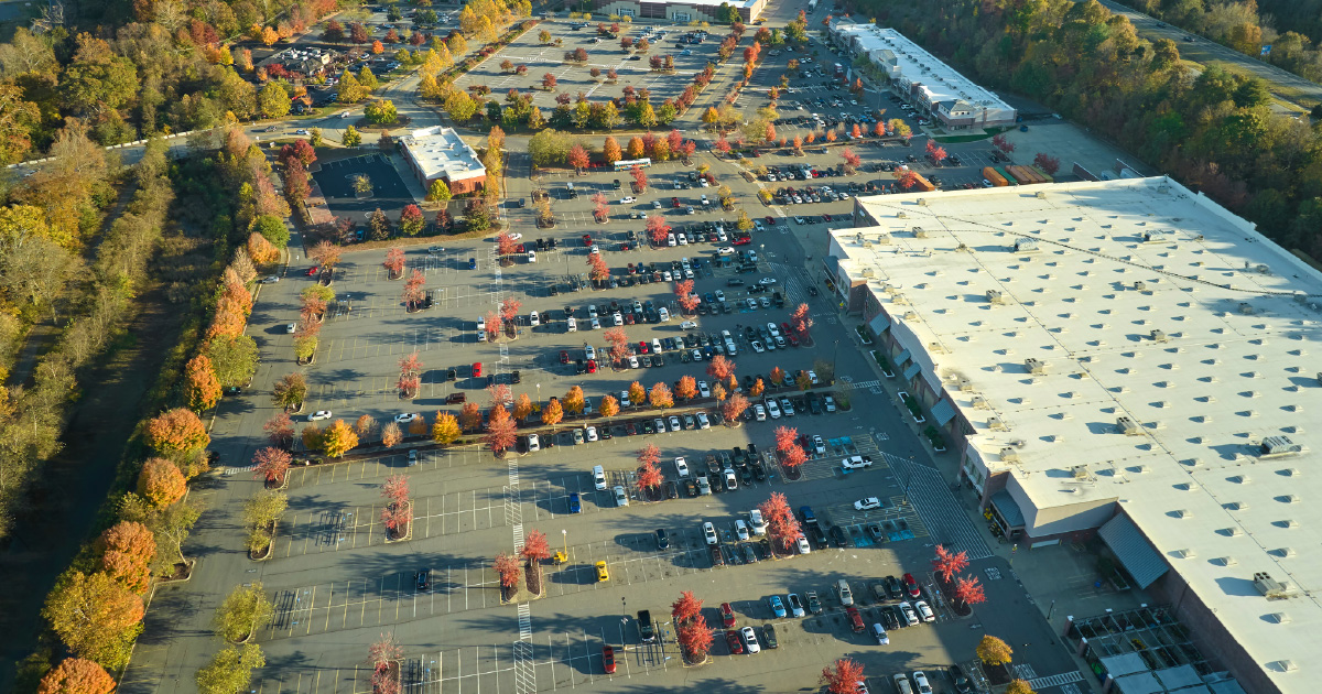 A grocery-anchored retail plaza viewed from above